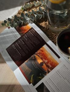 a magazine sitting on top of a table at Kairos Apartments - Spodek II - 100 m od Spodka in Katowice