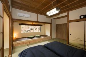 Una cama o camas en una habitación de 楽宿 -強羅- 031h