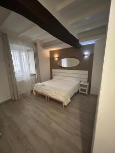 Ένα ή περισσότερα κρεβάτια σε δωμάτιο στο Borgo Guazzo Flat