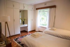 Beautiful historic stand alone in Muthaiga, Nairobi客房内的一张或多张床位