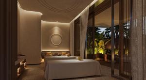 a hotel room with two beds and a balcony at InterContinental The Red Sea Resort by IHG in Ḩanak