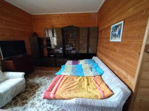 Posteľ alebo postele v izbe v ubytovaní Apartmán v dřevěném domě