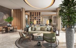 a living room with a couch and a table at InterContinental The Red Sea Resort by IHG in Ḩanak +198 photos