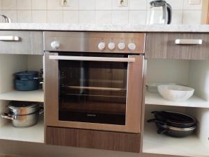Kuchyňa alebo kuchynka v ubytovaní Apartmán v dřevěném domě