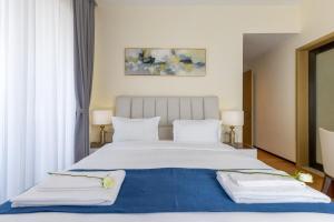 Postel nebo postele na pokoji v ubytování GTC Elephant 2 bed by YourHost, Nairobi + 27 fotografií
