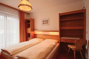 Letto o letti in una camera di Pension Riedlsperger