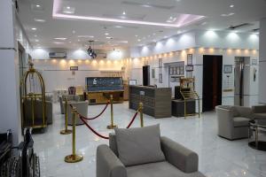 a store with chairs and tables in a room at شقق أهلين خمسة للشقق المخدومة in Riyadh