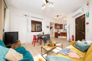 a living room with a couch and a table at Villa Pasiphae 2 in Stalos