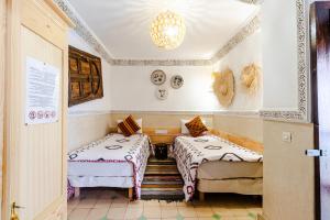 Postel nebo postele na pokoji v ubytování Riad Davina + 37 fotografií