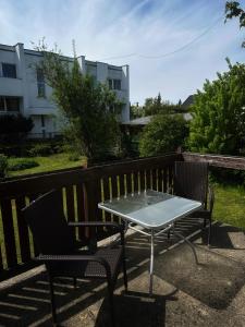 a table and two chairs sitting on a patio at Janno apartment in Pärnu +4 photos