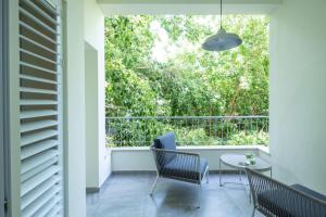 A balcony or terrace at Eclectic Dreams Rabin Square Apt with Shelter by Sea N' Rent