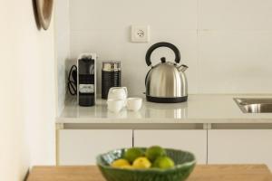 Coffee and tea making facilities at Eclectic Dreams Rabin Square Apt with Shelter by Sea N' Rent
