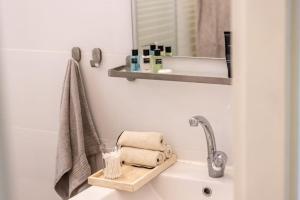 A bathroom at Eclectic Dreams Rabin Square Apt with Shelter by Sea N' Rent