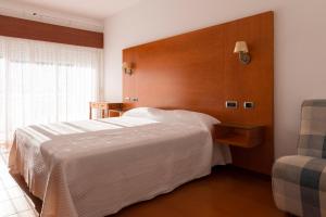 Postel nebo postele na pokoji v ubytování Hotel El Molino