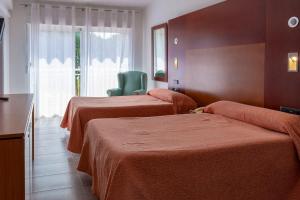Postel nebo postele na pokoji v ubytování Hotel El Molino
