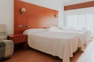 Postel nebo postele na pokoji v ubytování Hotel El Molino