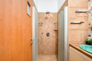 a bathroom with a shower and a sink at Nahariya Beachside Comfort Stay by Sea N Rent in Nahariyya +26 photos