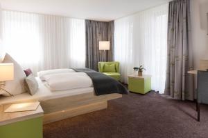 Postel nebo postele na pokoji v ubytování Hotel Rössle