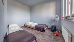 Postel nebo postele na pokoji v ubytování Apartamenty Sun & Snow Lisi Jar - sezonowy basen, blisko plaży, sauna