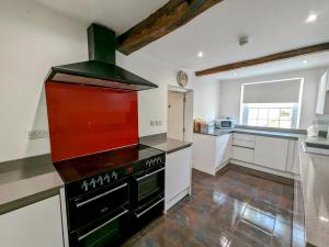 a kitchen with a black stove top oven at 6 Bed in Lamplugh SZ327 in Lamplugh +14 photos