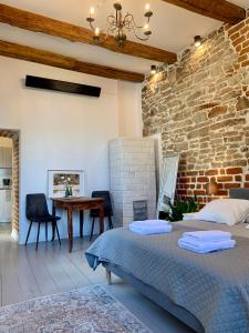 Ένα ή περισσότερα κρεβάτια σε δωμάτιο στο Apartamenty Magdalena