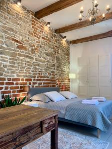 Ένα ή περισσότερα κρεβάτια σε δωμάτιο στο Apartamenty Magdalena