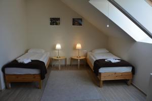 Ένα ή περισσότερα κρεβάτια σε δωμάτιο στο Elixbeer Kastély Sörház és Vendégház
