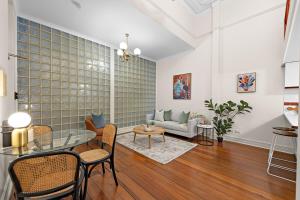 a living room with a glass table and a couch at Ultimate Fremantle Location in Fremantle