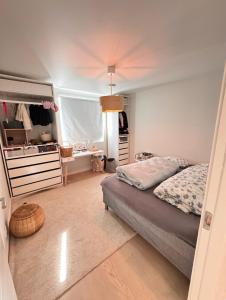 a bedroom with a bed and a desk in it at Luxury Villa with Heated Pool & Sea View Your Private Paradise on the Norwegian Coast in Kristiansand