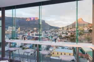 a view from a balcony overlooking a city at The Capital Mirage in Cape Town