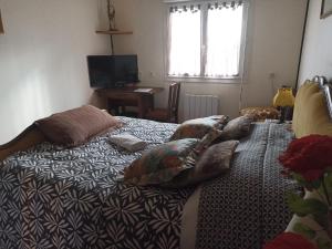 Postel nebo postele na pokoji v ubytování Les Chambres Du Rochereuil