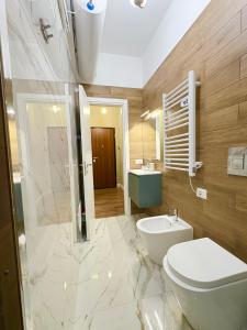 a bathroom with a toilet and a sink at Plebiscito 31 in Castel di Sangro +9 photos