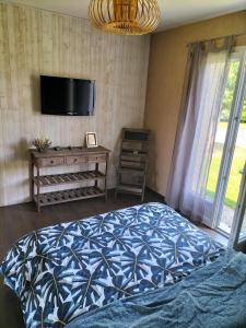 Ένα ή περισσότερα κρεβάτια σε δωμάτιο στο Maison circuit 24 heures du Mans