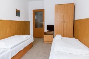 Postel nebo postele na pokoji v ubytování Hotel Tatrawest