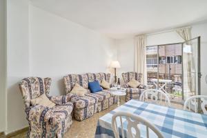 a living room with a couch and a table at Apartmento Calle Antonio Millón in Nerja