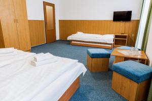 Postel nebo postele na pokoji v ubytování Hotel Tatrawest