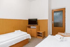 Postel nebo postele na pokoji v ubytování Hotel Tatrawest