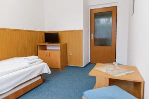 Postel nebo postele na pokoji v ubytování Hotel Tatrawest