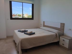 Postel nebo postele na pokoji v ubytování Residencial El Trenet 2A