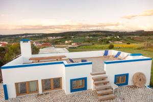 a villa with a view of the countryside at The Indigo Windmill Retreat, Peniche in Atouguia da Baleia