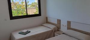 Postel nebo postele na pokoji v ubytování Residencial El Trenet 2A + 13 fotografií