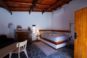 Postel nebo postele na pokoji v ubytování Fteri Stone House in Platanos, Akrata