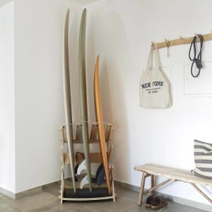 a rack of skis leaned up against a wall at Endless Ocean - Praia da Luz in Luz