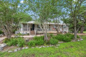 a home with a porch with trees and grass at OT 2905 BellaVida Haus in New Braunfels