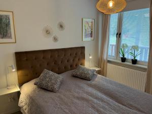 Postel nebo postele na pokoji v ubytování Järvsö Kramstatjärnsvägen 10E