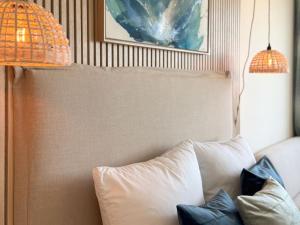 a white couch with pillows in a room at Marina Wendtorf Marinablick in Wendtorf