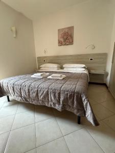 Postel nebo postele na pokoji v ubytování Le Corti Del Lago