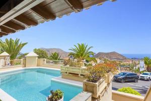 a swimming pool in a villa with a view at Villa Amara by Villa Plus in Chayofa