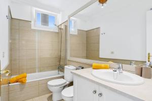 a bathroom with a toilet and a sink and a shower at Villa Amara by Villa Plus in Chayofa +19 photos