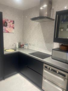 a kitchen with a sink and a counter top at Blissful Slumber in Ruskington +16 photos